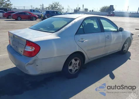 2003 Toyota Camry Le V6 z USA, uszkodzony, nr VIN 4T1BF32K83U544200